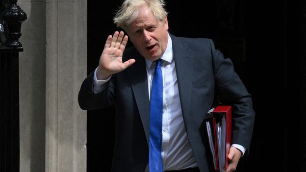 Britain's Prime Minister Boris Johnson leaves from 10 Downing Street in central London on July 6, 2022 to head to the Houses of Parliament for the weekly Prime Minister's Questions (PMQs) session - Sputnik International