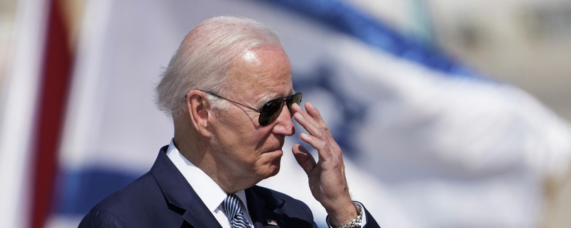 President Joe Biden adjusts his glasses during a welcoming ceremony upon his arrival at Ben Gurion International Airport near Tel Aviv, Israel Wednesday, July 13, 2022. Biden arrives in Israel on Wednesday for a three-day visit, his first as president.  - Sputnik International, 1920, 14.07.2022