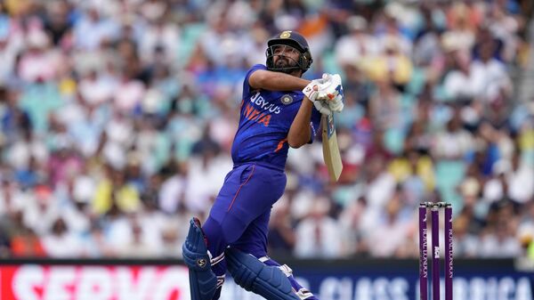 India's captain Rohit Sharma hits a six during the first one day international cricket match between England and India at the Oval cricket ground in London, Tuesday, July 12, 2022. - Sputnik International