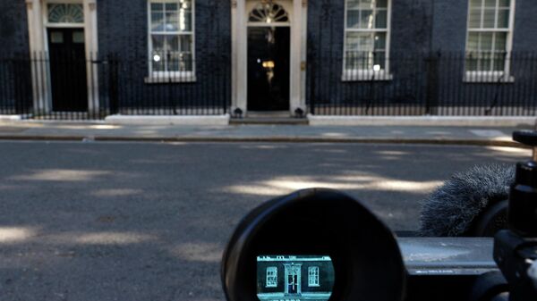 The door of 10 Downing Street, the official residence of Britain's Prime Minister, is seen through the viewfinder of a television broadcast camera in central London on July 8, 2022 - Sputnik International