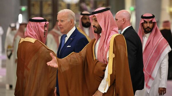 U.S. President Joe Biden, center left, and Saudi Crown Prince Mohammed bin Salman, center, arrive for the family photo during the GCC+3 (Gulf Cooperation Council) meeting at a hotel in Saudi Arabia's Red Sea coastal city of Jeddah Saturday, July 16, 2022 - Sputnik International