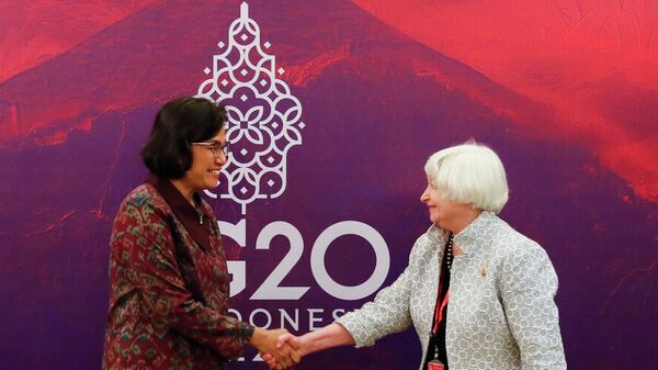 Indonesia's Finance Minister Sri Mulyani Indrawati (L) shakes hand with US Treasury Secretary Janet Yellen (R) during their bilateral meeting at the G20 Finance Ministers and Central Bank Governors Meeting in Nusa Dua on July 15, 2022 - Sputnik International