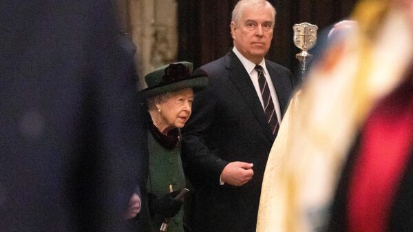 Britain's Queen Elizabeth II (L) and her son Britain's Prince Andrew, Duke of York, attend a Service of Thanksgiving for Britain's Prince Philip, Duke of Edinburgh, at Westminster Abbey in central London on March 29, 2022 - Sputnik International