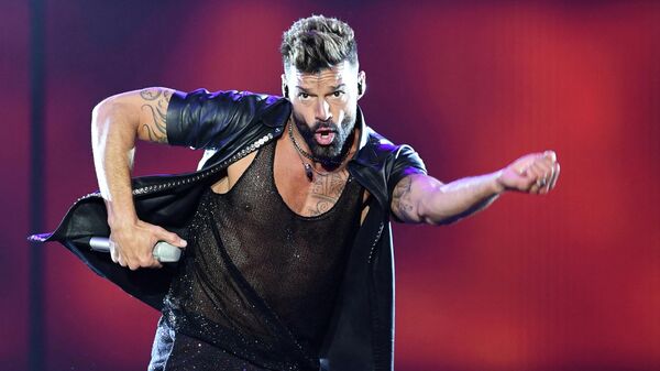 (FILES) In this file photo taken on March 02, 2020 Puerto Rican singer Ricky Martin performs during the Movimiento Tour show at the Antel Arena, in Montevideo. - Police in San Juan, Puerto Rico, reported Saturday that a judge has issued a restraining order against superstar Ricky Martin. (Photo by Pablo PORCIUNCULA / AFP) - Sputnik International