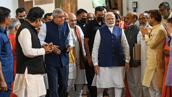 Former Bengal Governor and National Democratic Alliance (NDA) nominee for vice president Jagdeep Dhankhar (3L) leaves the Parliament House with top Bharatiya Janata Party (BJP) leaders and Indian Prime Minister Narendra Modi (centre R) after filing his nomination for the vice president election in New Delhi on July 18, 2022. - Sputnik International