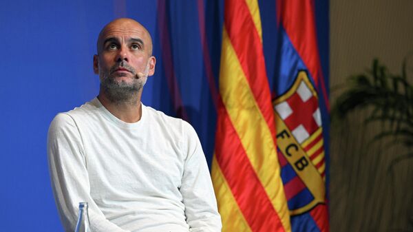 Manchester City's Spanish manager Pep Guardiola attends the presentation of the friendly match between FC Barcelona and Manchester City at Camp Nou stadium, in Barcelona, on June 20, 2022.  - Sputnik International