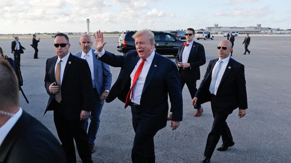 In this April 18, 2019, file photo, President Donald Trump, center, surrounded by members of the Secret Service, walks across the tarmac to begin to greet supporters during his arrival at Palm Beach International Airport, in West Palm Beach, Fla. As the Russia investigation threatened to shadow Donald Trump’s presidency, he became increasingly concerned he would be seen as a cheater and a fraud.  - Sputnik International