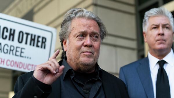 Former White House strategist Steve Bannon, left, speaks with reporters as he departs federal court on Friday, July 22, 2022, in Washington, with his attorney M. Evan Corcoran, right. Bannon, a longtime ally of former President Donald Trump has been convicted of contempt charges for defying a congressional subpoena from the House committee investigating the Jan. 6 insurrection at the U.S. Capitol. - Sputnik International