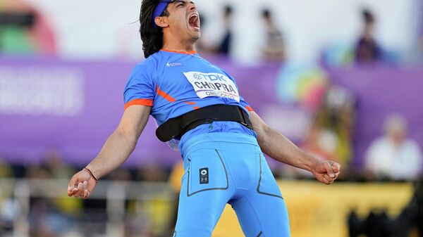 Silver medalist Neeraj Chopra, of India, celebrates during the men's javelin throw final at the World Athletics Championships on Saturday, July 23, 2022, in Eugene, Ore.  - Sputnik International