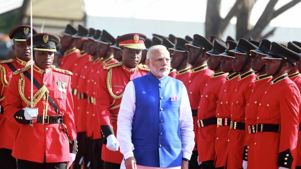 Indian Prime Minister Narendra Modi inspects a guard of honor during an official welcome ceremony for him at State House Grounds in Dar es Salaam, Sunday July 10, 2016. - Sputnik International
