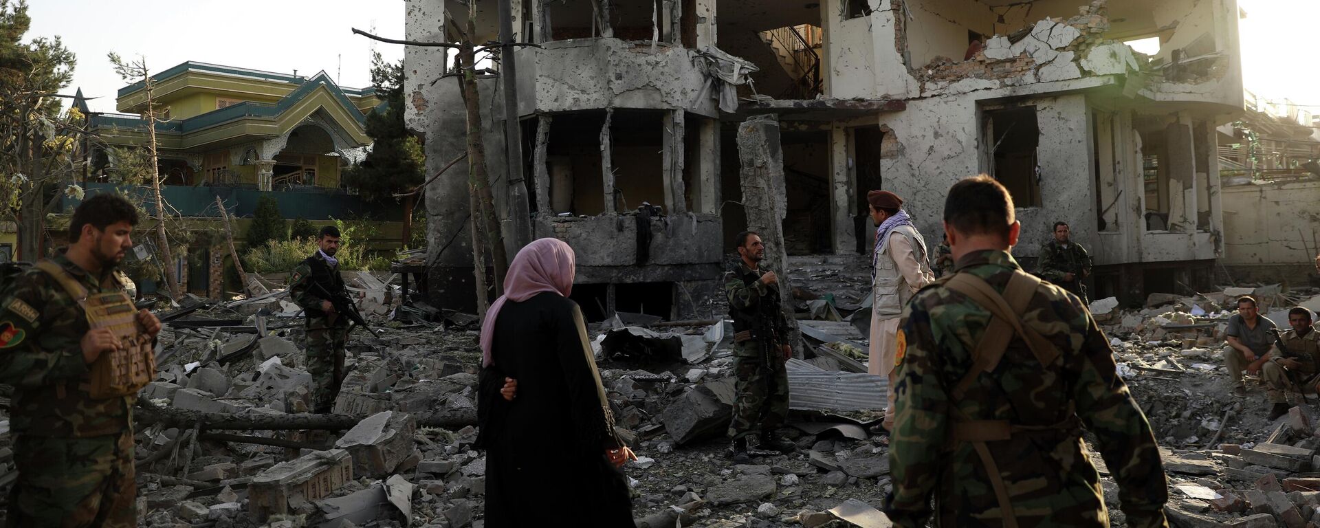 Afghan security personnel inspect a damaged building in the aftermath of an attack in Kabul, Afghanistan, on Aug. 4, 2021. - Sputnik International, 1920, 26.02.2026
