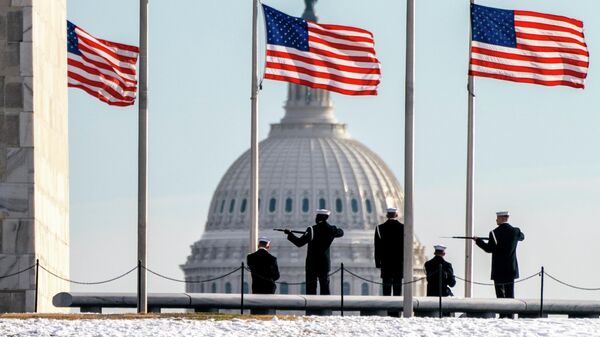 A year after the attack on the U.S. Capitol, Thursday, Jan. 6, 2022, a U.S. Navy Ceremonial Guard poses with their rifles during a photo session with their official photographer, with the Capitol in the background, on the National Mall in Washington - Sputnik International
