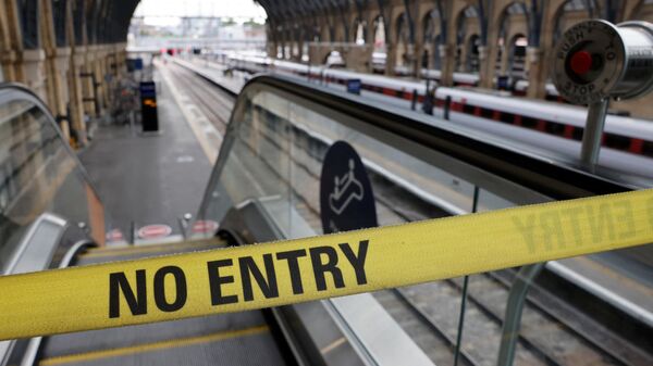 A No Entry belt barrier blocks access to a platform at King's Cross railway station in London on July 27, 2022 as fresh railway strikes hit the country - Sputnik International