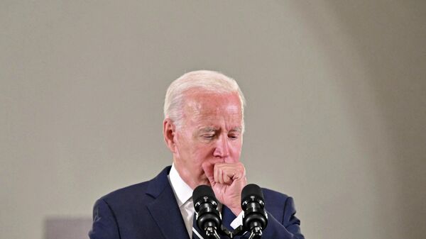 (FILES) In this file photo taken on July 15, 2022 US President Joe Biden coughs as he delivers remarks during a visit to the Augusta Victoria Hospital in Jerusalem on July 15, 2022.  - Sputnik International