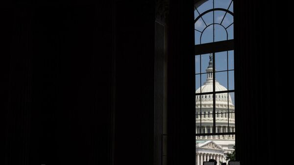 WASHINGTON, DC - JUNE 13: A view of the U.S. Capitol building from outside the hearing room during a hearing on the January 6th investigation in the Cannon House Office Building on June 13, 2022 in Washington, DC. - Sputnik International