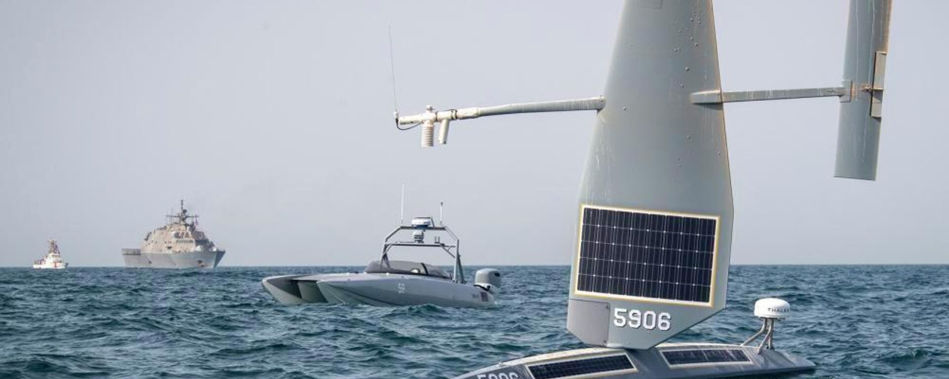 In this image provided by the U.S. Navy, a Saildrone Explorer, front to rear, a Devil Ray T-38 crewless vessel, a littoral combat ship, and a U.S. Coast Guard cutter sail in the Arabian Gulf, on June 26, 2022. The Navy is expediting development of drone ships aimed at expanding the reach of offensive firepower while keeping sailors on traditional warships farther from harm's way. (U.S. Navy photo by Chief Mass Communication Specialist Roland A. Franklin via AP) - Sputnik International, 1920, 01.08.2022