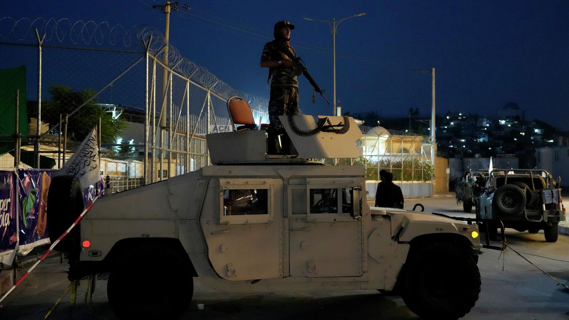A Taliban fighter stands guard at the site of an explosion in front of the Kabul International Cricket Stadium, in Kabul, Afghanistan, Friday, July 29, 2022.  - Sputnik International, 1920, 01.08.2022