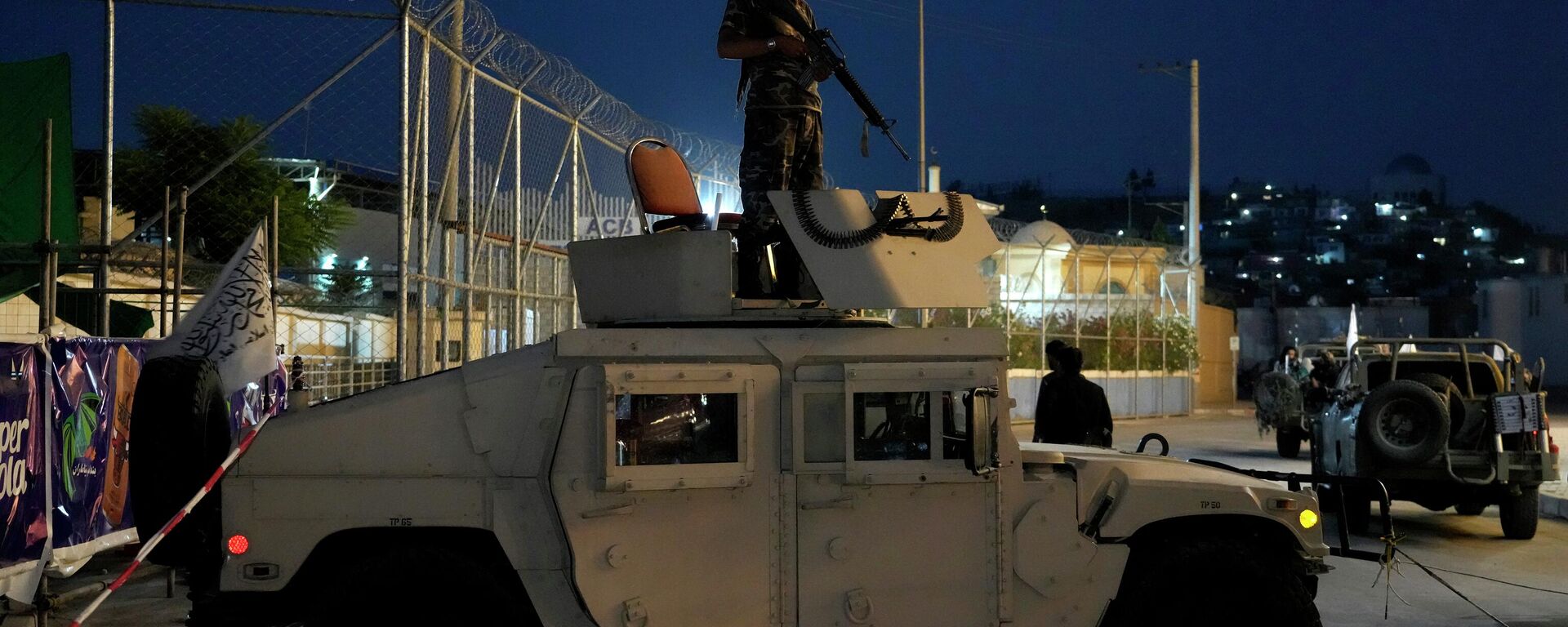 A Taliban fighter stands guard at the site of an explosion in front of the Kabul International Cricket Stadium, in Kabul, Afghanistan, Friday, July 29, 2022.  - Sputnik International, 1920, 01.08.2022