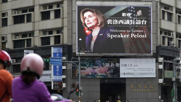 People walk past a billboard welcoming U.S. House Speaker Nancy Pelosi, in Taipei, Taiwan, Wednesday, Aug 3, 2022 - Sputnik International