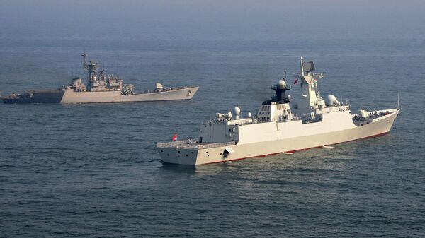 In this handout photograph released by the Indian Ministry of Defence on May 17, 2014, the Chinese PLA Navy ship Weifang (R) is pictured in the waters off Visakhapatnam while escorted by the Indian Navy corvette INS Kora (P61). The Chinese ships Zhenghe and Weifang are on a four-day visit to the India's Eastern Naval Command, with professional, cultural, social and sports events planned between the Chinese and Indian sailors.  - Sputnik International