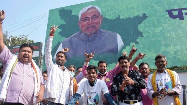 Supporters of Janata Dal (United) celebrate the lead of their party alliance in initial results for the Bihar state assembly polls, in Patna, India, Tuesday, Nov. 10, 2020. - Sputnik International
