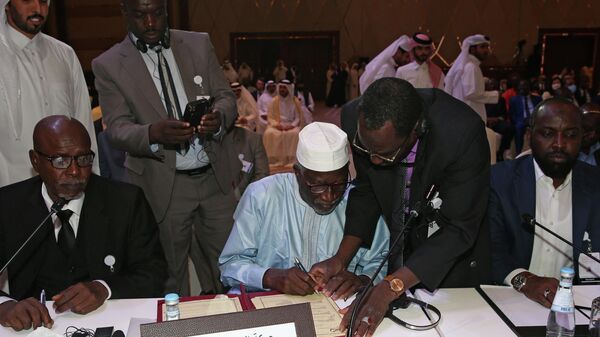 A picture taken on August 8, 2022 in the Qatari captial Doha shows the signing ceremony between Chad's military authority and more than 40 opposition groups to launch national peace talks later this month, in the absence of The Front for Change and Concord in Chad (FACT), the main rebel group. - Sputnik International