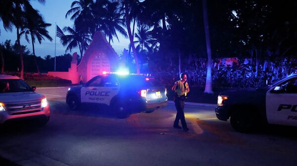 Police direct traffic outside an entrance to former President Donald Trump's Mar-a-Lago estate, Monday, Aug. 8, 2022, in Palm Beach, Fla. Trump said in a lengthy statement that the FBI was conducting a search of his Mar-a-Lago estate and asserted that agents had broken open a safe. (AP Photo/Terry Renna) - Sputnik International