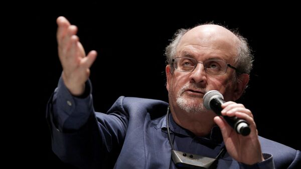 In this file photo taken on September 13, 2016, British writer Salman Rushdie speaks during the opening day of the Positive Economy Forum in Le Havre, northwestern France on September 13, 2016. - It has been reported that Rushdie was attacked on stage today during an event in New York. (Photo by CHARLY TRIBALLEAU / AFP) - Sputnik International