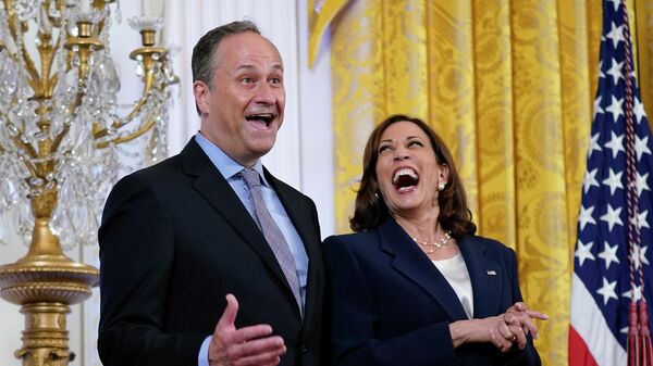 Vice President Kamala Harris, right, laughs as her husband Doug Emhoff, center, responds to a question from first lady Jill Biden as she speaks during an event to celebrate Pride Month in the East Room of the White House, Wednesday, June 15, 2022, in Washington. - Sputnik International