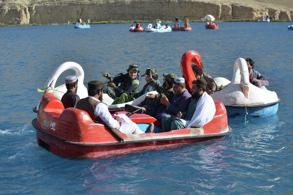 This picture taken on 14 July 2022 shows Taliban fighters taking a boat ride at Band-e Amir Lake in Bamyan province. - Sputnik International