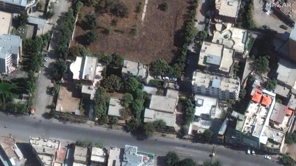 This handout image courtesy of Maxar Technologies released on August 2, 2022 and taken on October 13, 2021 shows the builiding (L) in which Al-Qaeda chief Ayman al-Zawahiri was probably located at the time of the strike that killed him in Kabul. - Sputnik International