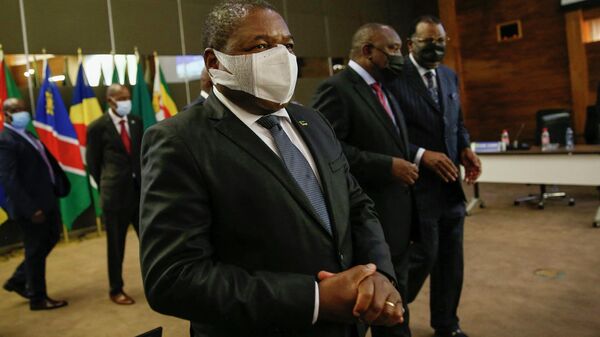 Mozambican President Filipe Nyusi (L), South African President and Southern African Development Community (SADC) Chairperson on Politics, Defence and Security Cooperation Cyril Ramaphosa (C) and Namibia's President Hage Geingob (R) leave following the conclusion of the Extraordinary Summit of the SADC Organ Troika Plus the Republic of Mozambique at the OR Tambo Building in Pretoria, on October 5, 2021. The Summit will receive a progress report on the operations of the SADC Mission to Mozambique since its deployment and will consider the way forward as the deployment to combat acts of terrorism and violent extremism in the Northern Region of Cabo Delgado Province comes to an end on 15 October 2021. (Photo by Phill Magakoe / AFP) - Sputnik International