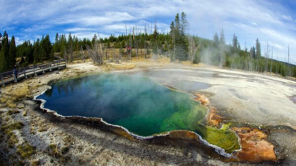 The Abyss geothermal pool is seen October 8, 2012 in Yellowstone National Park in Wyoming. Yellowstone protects 10,000 or so geysers, mudpots, steamvents, and hot springs.Yellowstone National Park is America's first national park.  - Sputnik International