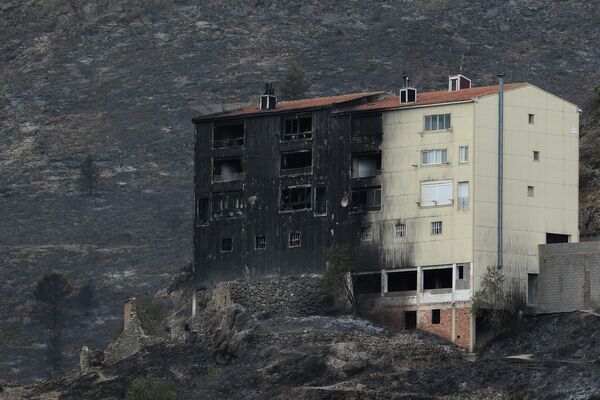 A partially charred building during a wildfire near Bejis, eastern Spain, on August 17, 2022.  - Sputnik International