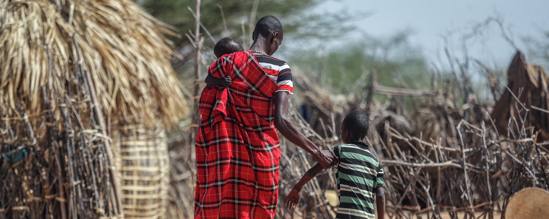 A father helps his malnourished son to walk near their hut in the village of Lomoputh in northern Kenya Thursday, May 12, 2022. United Nations Under-Secretary-General for Humanitarian Affairs Martin Griffiths visited the area on Thurs - Sputnik International, 1920, 19.08.2022