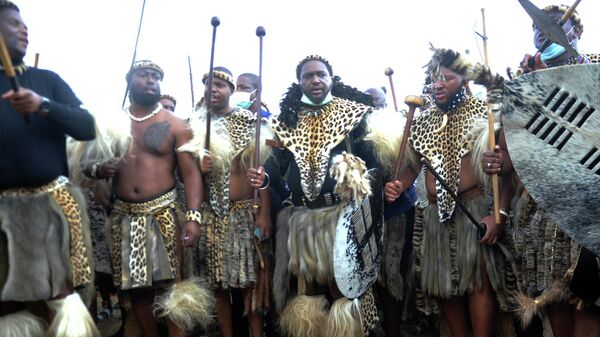 FILE — King Misuzulu ka Zwelithini, centre, stands flanked by fellow warriors in traditional dress at the KwaKhangelamankengane Royal Palace, during a ceremony, in Nongoma, South Africa, Friday May 7, 2021. South Africa's ethnic Zulu nation will on Saturday Aug. 20, 2022 host a coronation event for King Misuzulu ka Zwelithini amid internal divisions that have threatened to tear the royal family apart. - Sputnik International