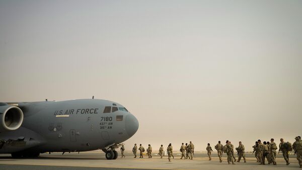This image taken by the U.S. Air Force shows U.S. Army troops from the 1st Combined Arms Battalion, 163rd Cavalry Regiment, board a C-17 Globemaster III during an exercise at Ali Al Salem Air Base, Kuwait, Aug. 10, 2022 - Sputnik International