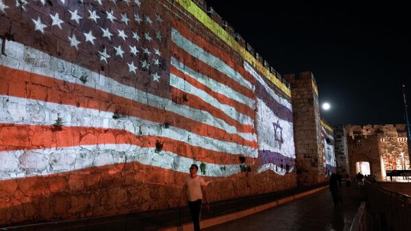Image of the U.S. and Israeli flags is projected on the walls of Jerusalem's Old City in honor of President Joe Biden visit to Jerusalem, Wednesday, July 13, 2022. - Sputnik International