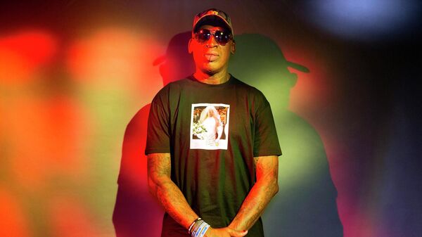 In this Monday, Sept. 9, 2019, photo, former NBA star Dennis Rodman poses wearing a T-shirt depicting himself in a wedding dress at a 1996 book promo event, in Los Angeles.  - Sputnik International