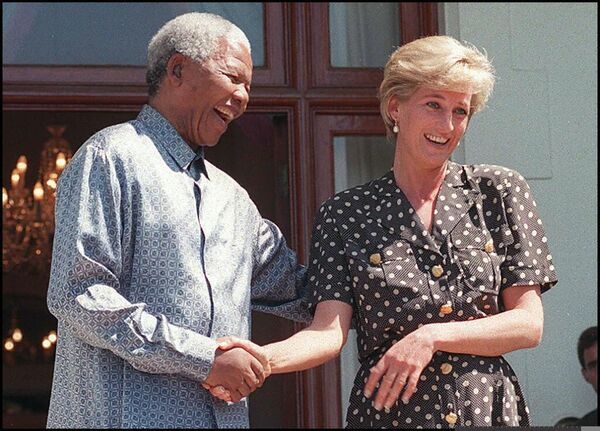 In this file photo taken on March 17, 1997 South African President Nelson Mandela (L) and Princess Diana speak with the press after meeting in the Mandela&#x27;s home, Goldendale, in Cape Town, South Africa.  It is Diana&#x27;s first public appearance since her arrival in South Africa last week to visit her brother Charles Spencer. - From her engagement to Prince Charles as a shy teenager to her roles as doting mother, humanitarian and global celebrity, Diana&#x27;s turbulent life still captivates people around the world. - Sputnik International