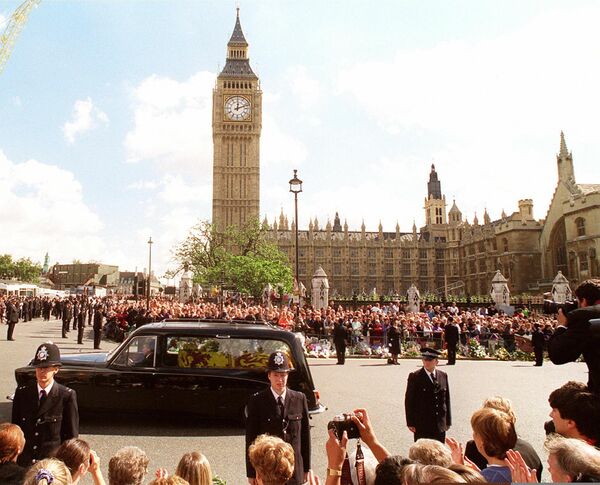 In this file photo taken on September 6, 1997 the hearse carrying the coffin of Diana, Princess of Wales takes her on her final journey to the Althorpe family home in Northamptonshire which she will be buried on a small island on a lake in the grounds of the estate. The hearse is seen passing by Big Ben in Parliament Square following the funeral service at Westminister Abbey. - From her engagement to Prince Charles as a shy teenager to her roles as doting mother, humanitarian and global celebrity, Diana&#x27;s turbulent life still captivates people around the world. - Sputnik International