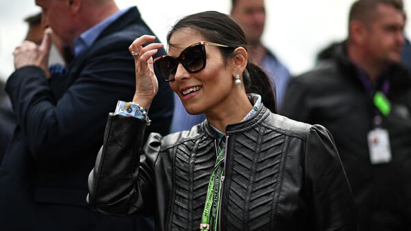 Britain's Home Secretary Priti Patel reacts on the starting grid ahead of the Formula One British Grand Prix at the Silverstone motor racing circuit in Silverstone, central England on July 3, 2022 - Sputnik International