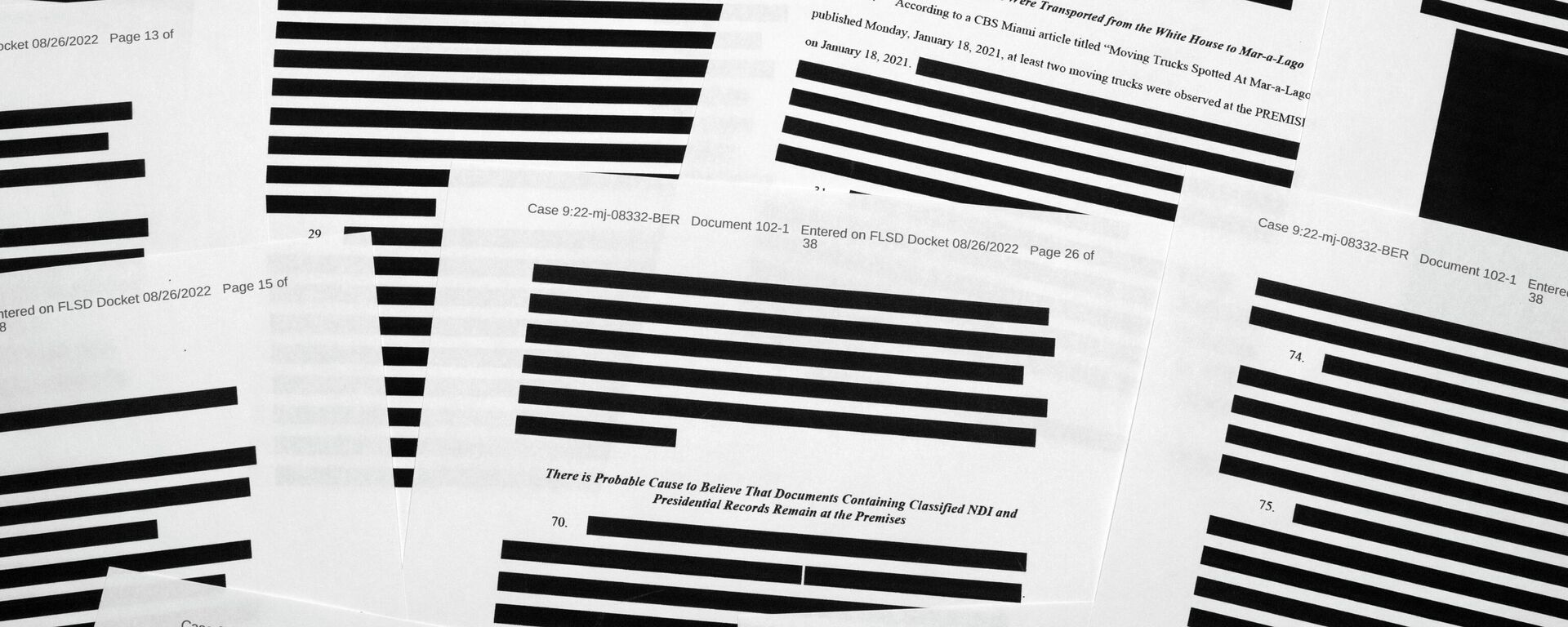 Pages from the affidavit by the FBI in support of obtaining a search warrant for former President Donald Trump's Mar-a-Lago estate are photographed Friday, Aug. 26, 2022. U.S. Magistrate Judge Bruce Reinhart ordered the Justice Department to make public a redacted version of the affidavit it relied on when federal agents searched Trump's estate to look for classified documents.  - Sputnik International, 1920, 21.10.2022