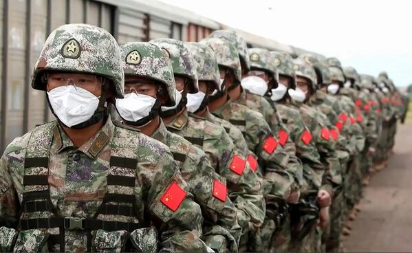 Chinese soldiers marching along a railway platform upon their arrival for the Vostok-2022 military drills at the Sergeevsky training ground in Primorsky Krai, Russia&#x27;s Far East. - Sputnik International