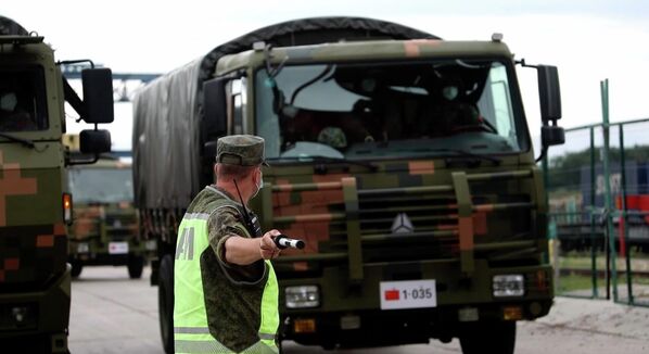 Chinese military vehicles arrive at the Sergeevsky training ground during preparations for the Vostok-2022 military exercise. - Sputnik International