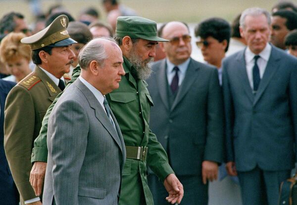 FILE - In this April 3, 1989 file photo, Cuban President Fidel Castro and his brother, Defense Minister Gen. Raul Castro, left, escort Soviet Union President Mikhail Gorbachev during a welcoming ceremony at the airport, in Havana, Cuba. In the heyday of Soviet aid to Cuba, the socialist state was a paternalistic presence that provided modest but comfortable lives to virtually everyone on the island. But life in Cuba changed dramatically after the fall of the Soviet Union in 1991 resulting in a crisis known as the Special Period. - Sputnik International