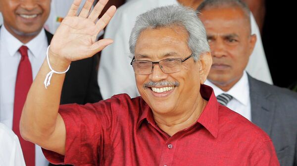Then-Sri Lankan presidential candidate Gotabaya Rajapaksa waves to media as he leaves the election commission after filing his nomination in Colombo, Sri Lanka, Monday, Oct. 7, 2019. Former Sri Lanka President Rajapaksa, who fled his country last month during anti-government unrest and then resigned his position, is expected to visit Thailand, a Thai official said Wednesday, Aug. 10, 2022.  - Sputnik International