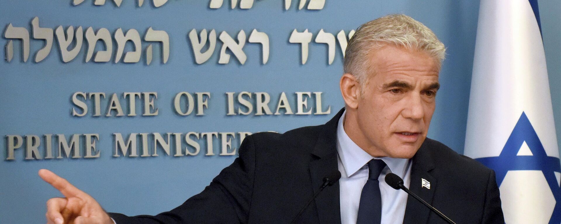 Israeli Prime Minister Yair Lapid speaks about Iran at a security briefing for the foreign press at the Prime Minister's office in Jerusalem, Wednesday, Aug. 24, 2022. Lapid called on U.S. President Joe Biden and Western powers to call off an emerging nuclear deal with Iran, saying an agreement would fail to prevent Iran from developing a nuclear bomb and reward it with billions of dollars to fund Israel's enemies. Israel's caretaker prime minister used stark language on Wednesday in his criticism of the expected agreement. (Debbie Hill/Pool via AP) - Sputnik International, 1920, 22.09.2022