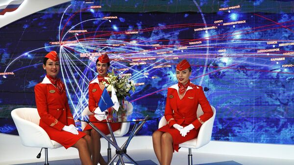 Girls dressed as stewardesses at the Aeroflot stand at the Eastern Economic Forum in Vladivostok. - Sputnik International