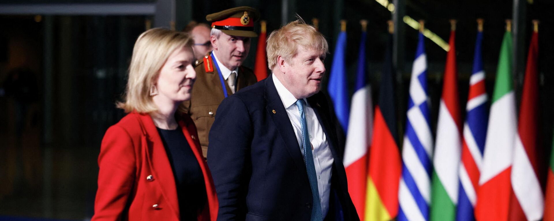 Britain's Prime Minister Boris Johnson (R) Britain's Foreign Secretary Liz Truss (L) and Britain's military representative to NATO Ben Bathurst (REAR) leave NATO Headquarters following a summit  in Brussels on March 24, 2022. - Sputnik International, 1920, 05.09.2022